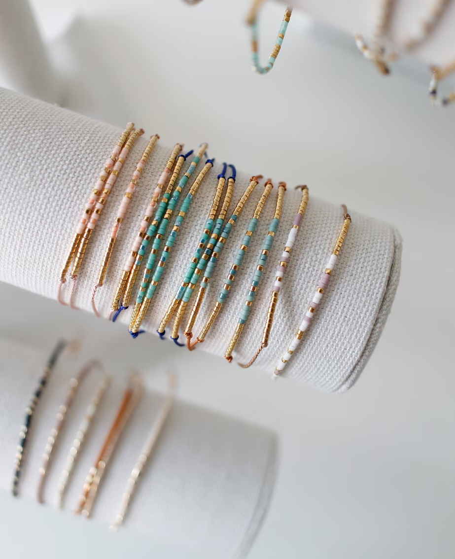 Stackable beaded bracelets on wrist