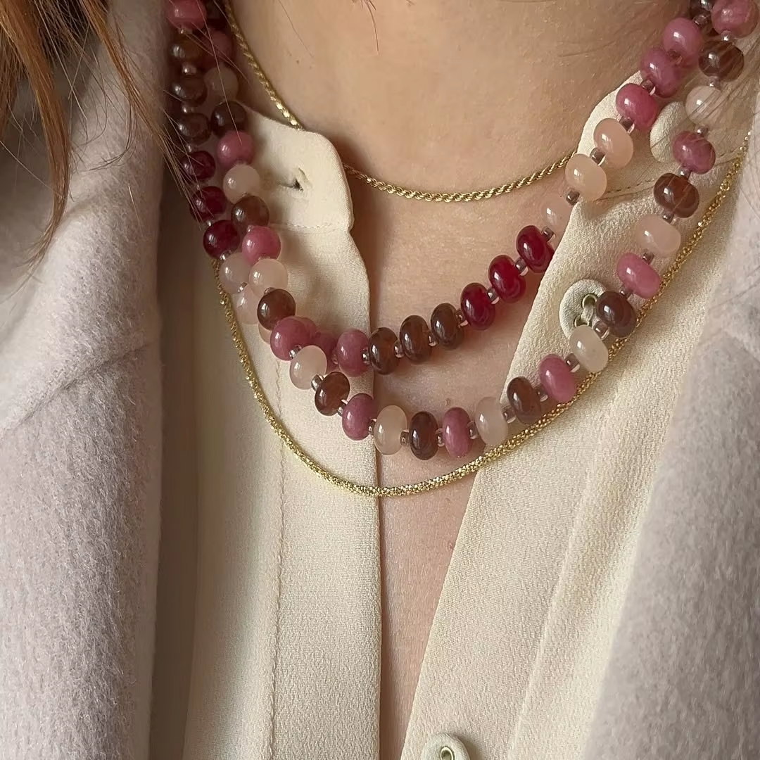 Layered agate bead necklace worn on model
